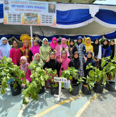 Photo 2: Outdoor school event with students and teachers smiling and participating in activities on a sunny day